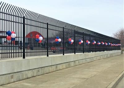 Balloon buttons on outside fence-Mirabito Stadium