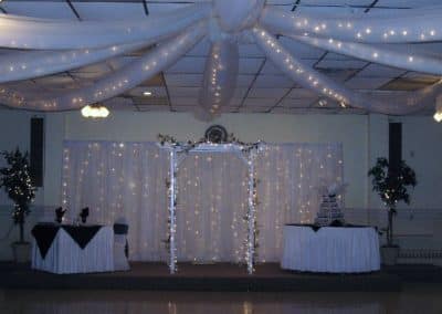 Sweetheart table, cake table with fabric and lights-Kalurah