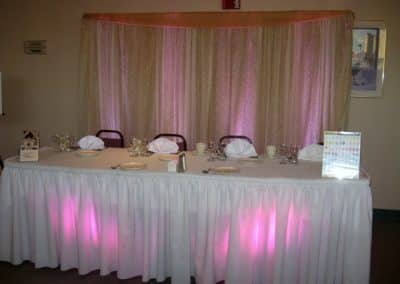 Headtable with pink up-lighting-Owego Treadway
