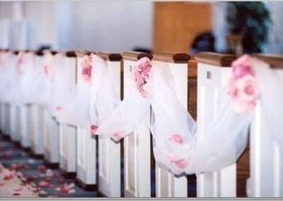 Wedding aisle flowers and tulle