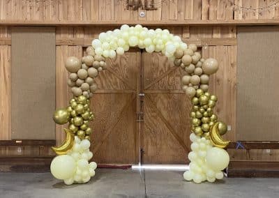 Moon welcome balloon arch golds, ivory and browns-Troy Sale Barn
